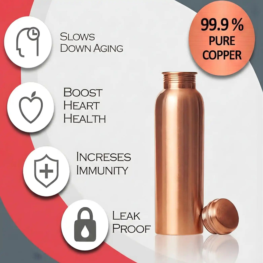Pure copper water bottle on marble countertop with tulsi leaves and lemon slices in warm kitchen lighting