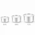 Three stainless steel tope cooking vessels set with capacities 0.4L, 0.8L and 1.2L on white background