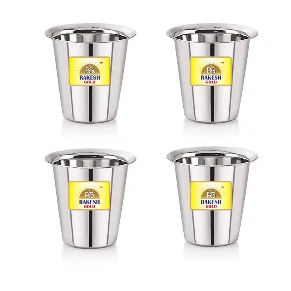 Four stainless steel cups with Rakesh Gold label on a white background