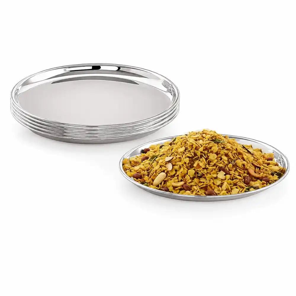 Set of silver trays with a bowl of cereal on a white background